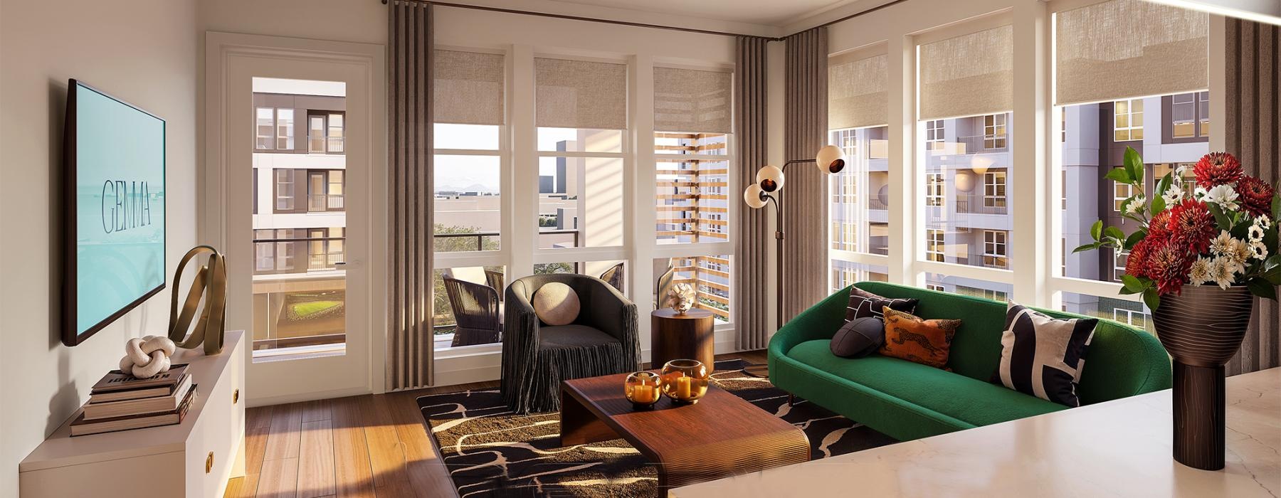 Open space living area with natural lighting and a green couch