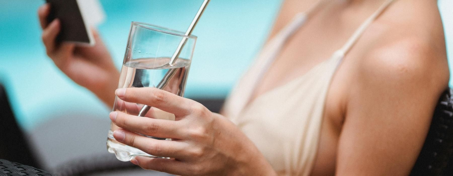 a person holding a glass